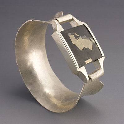 hammer formed & cast silver bangle with pyrite included slate cabochon